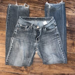 Has distress on bottoms inner thigh